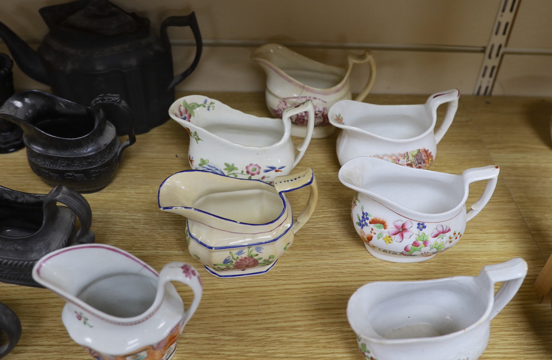 A collection of Regency stoneware and porcelain tea wares, including a small collection of black basalt, Castleford type etc. tallest teapot 17cm high